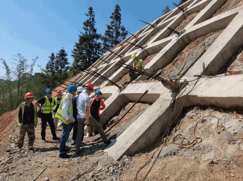 Slope reinforcement construction for foundation shear resistance