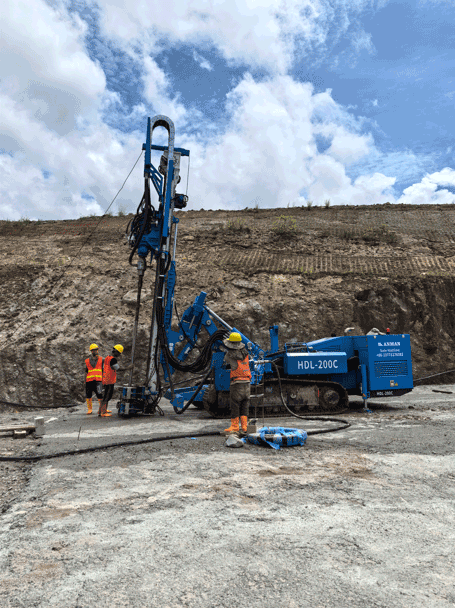 HDL-200C drill performing cement curtain drilling at rock slope site